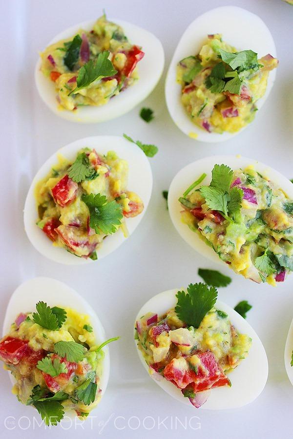 Guacamole Deviled Eggs – For potlucks and parties, these delicious guacamole deviled eggs are an easy, healthy hit! | thecomfortofcooking.com