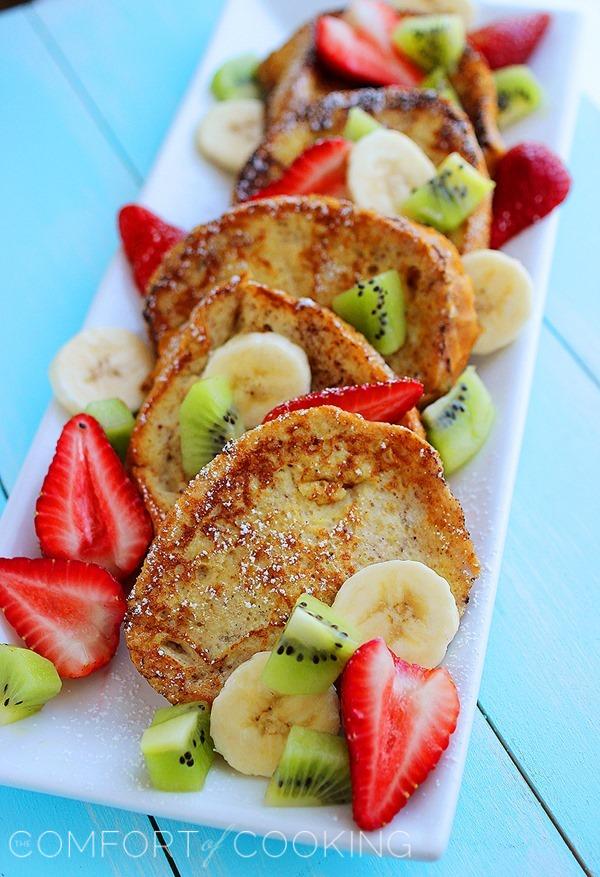 Overnight Cinnamon-Vanilla French Toast – Simple, scrumptious French toast piled with fruit that’s ready to sizzle in the skillet when you wake up! | thecomfortofcooking.com