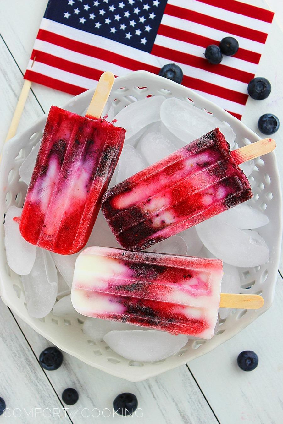 Firecracker Berry Frozen Yogurt Pops – Yogurt, strawberries and blueberries make these patriotic pops a guilt-free treat! | thecomfortofcooking.com