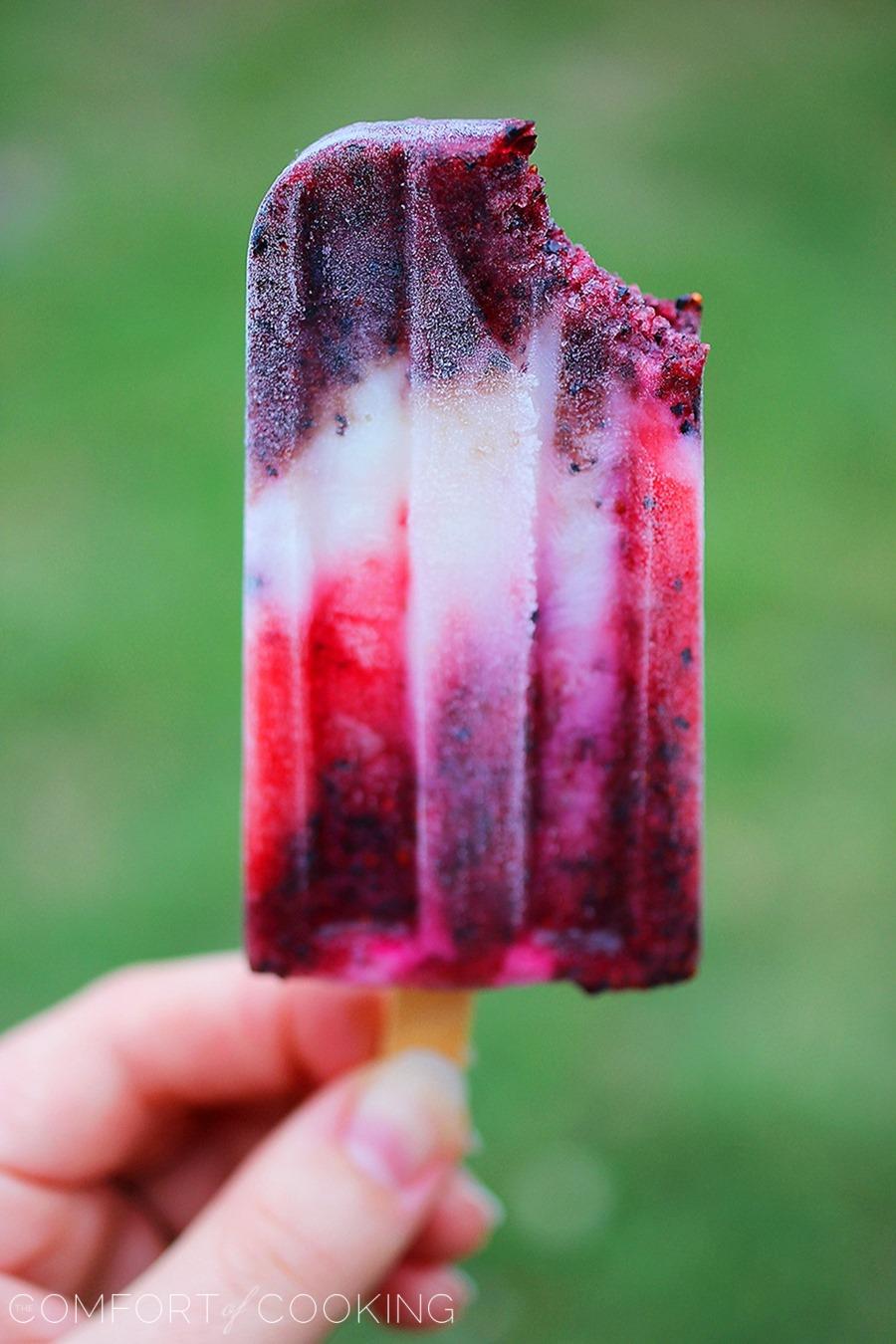 Firecracker Berry Frozen Yogurt Pops – Yogurt, strawberries and blueberries make these patriotic pops a guilt-free treat! | thecomfortofcooking.com