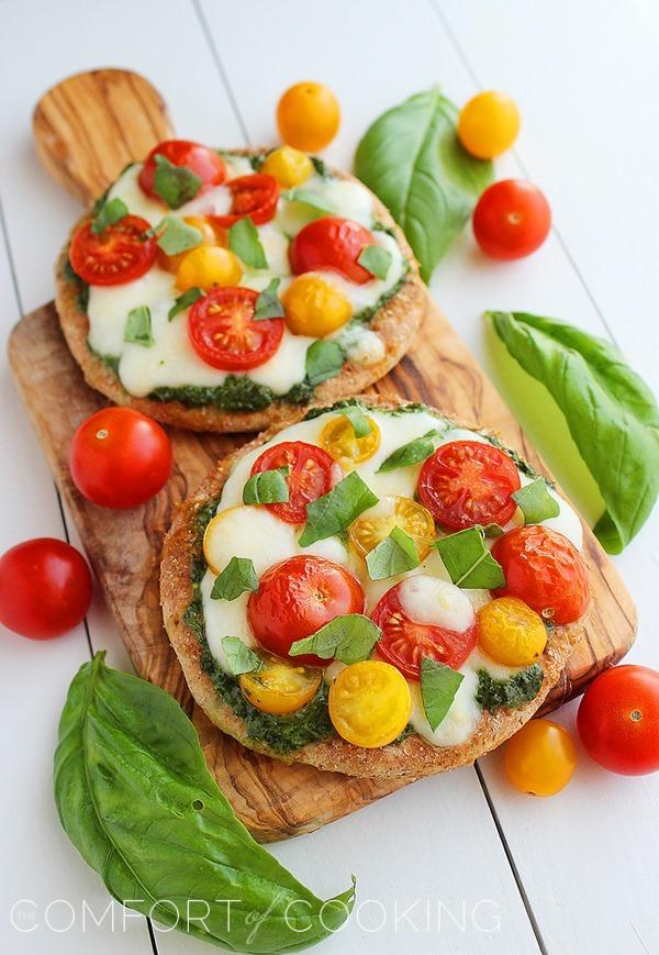 Mini Whole Wheat Pesto Caprese Pizzas – These healthy, colorful pizzas with fresh pesto make for a fun twist on dinner and an easy next-day lunch! | thecomfortofcooking.com