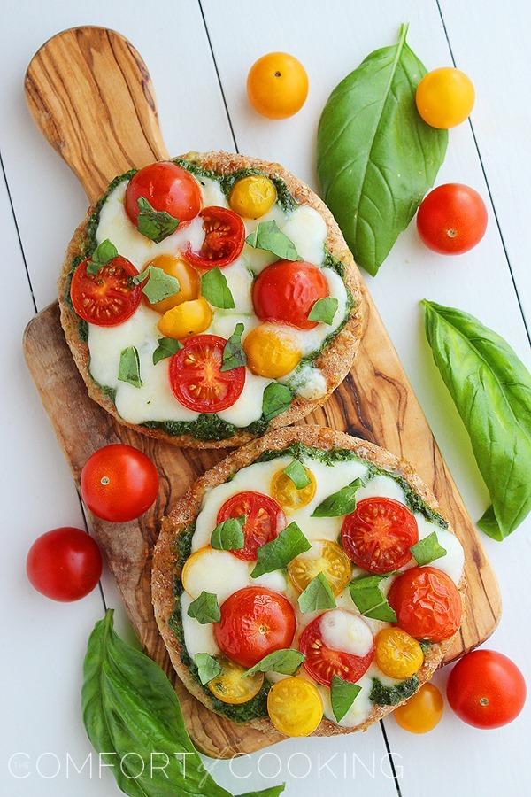 Mini Whole Wheat Pesto Caprese Pizzas – These healthy, colorful pizzas with fresh pesto make for a fun twist on dinner and an easy next-day lunch! | thecomfortofcooking.com