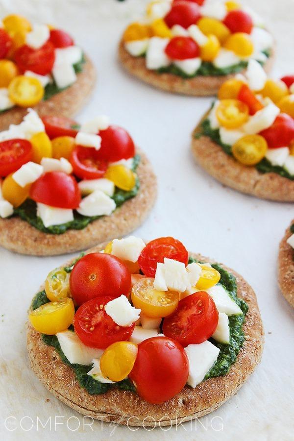 Mini Whole Wheat Pesto Caprese Pizzas – These healthy, colorful pizzas with fresh pesto make for a fun twist on dinner and an easy next-day lunch! | thecomfortofcooking.com