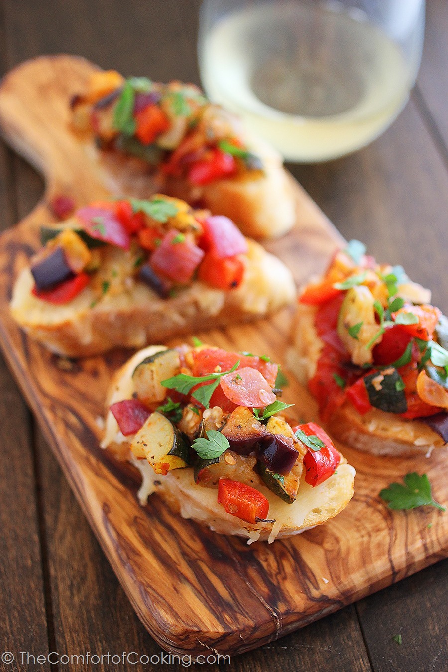 Ratatouille Crostini – Put those pretty summer veggies to use in this colorful, healthy and delish appetizer! | thecomfortofcooking.com