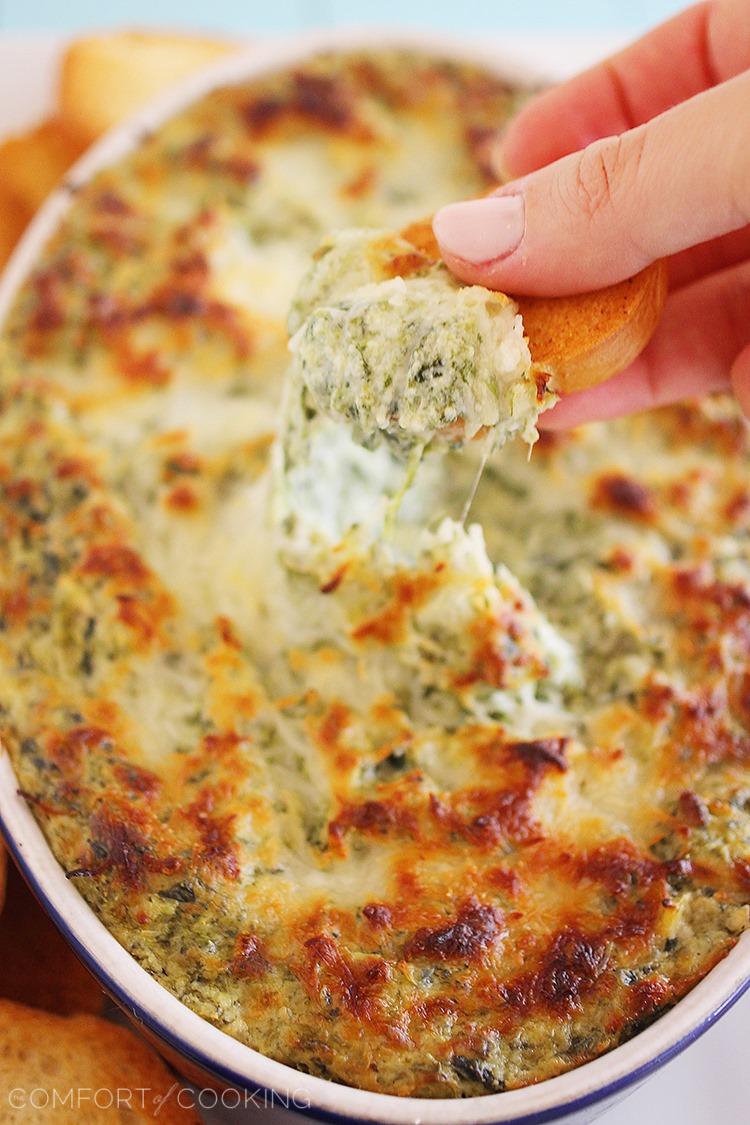 Hot Cheesy Spinach-Artichoke Dip – Super easy, cheesy dip that pairs perfectly with toasty baguettes, crackers and pretzels! | thecomfortofcooking.com