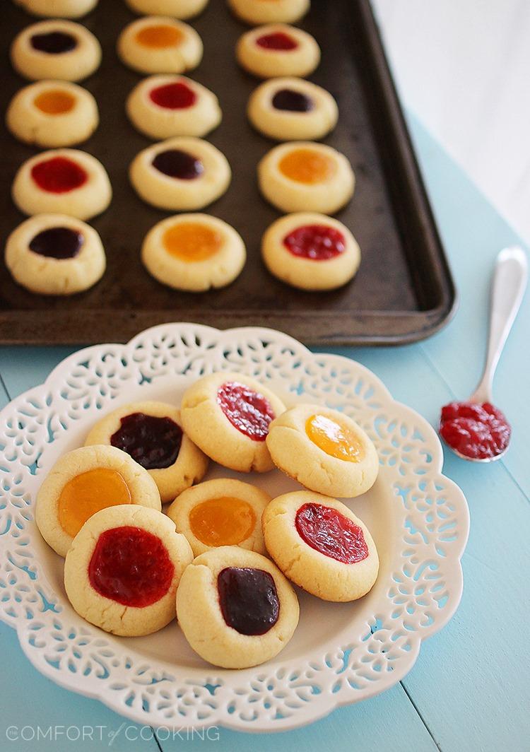 Jam Thumbprint Cookies – Buttery soft cookies with a sweet jam surprise. These simple, delicious jewel-hued cookies are amazing! | thecomfortofcooking.com