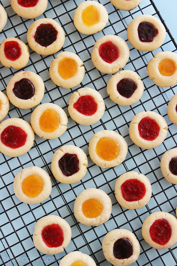 Jam Thumbprint Cookies – Buttery soft cookies with a sweet jam surprise. These simple, delicious jewel-hued cookies are amazing! | thecomfortofcooking.com