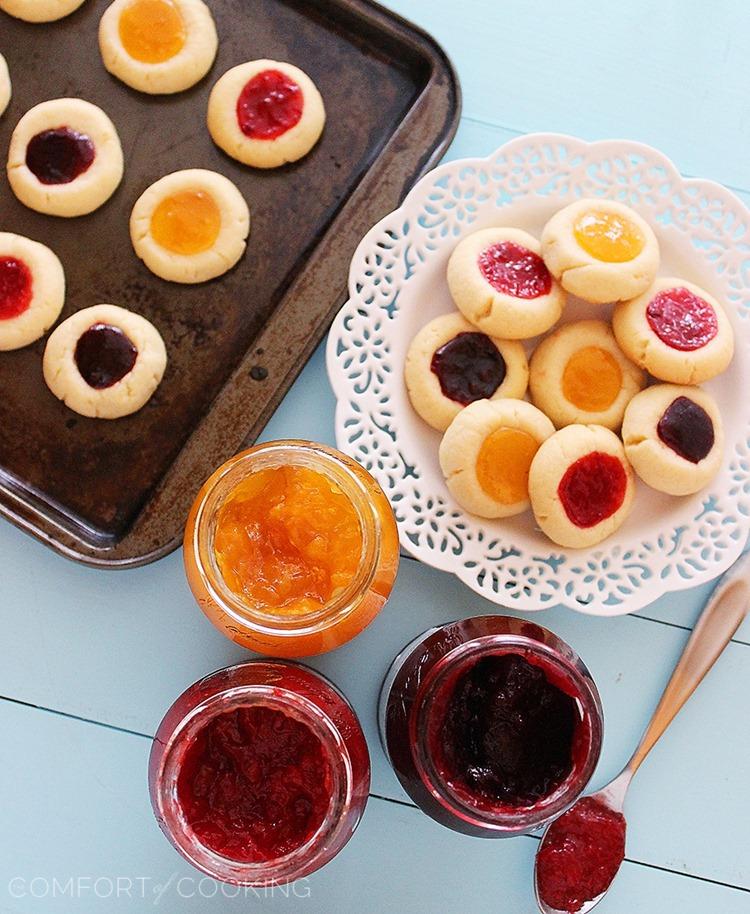 Jam Thumbprint Cookies – Buttery soft cookies with a sweet jam surprise. These simple, delicious jewel-hued cookies are amazing! | thecomfortofcooking.com