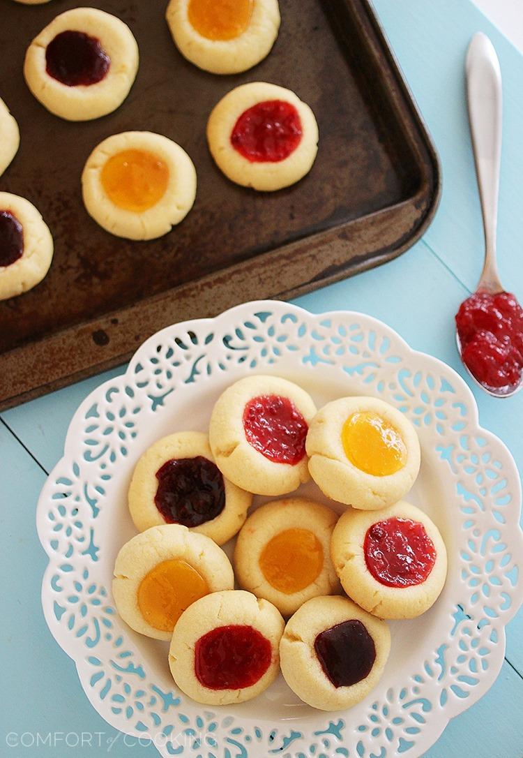 Jam Thumbprint Cookies – Buttery soft cookies with a sweet jam surprise. These simple, delicious jewel-hued cookies are amazing! | thecomfortofcooking.com