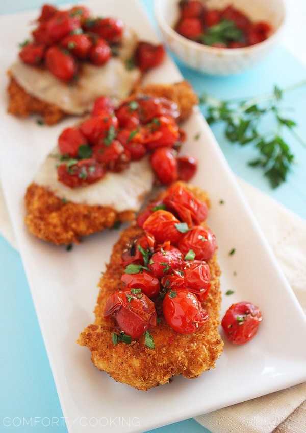 Crispy Parmesan Chicken with Balsamic Roasted Tomatoes – Crispy cutlets topped with sweet, juicy balsamic tomatoes is one of our favorite easy weeknight meals! | thecomfortofcooking.com