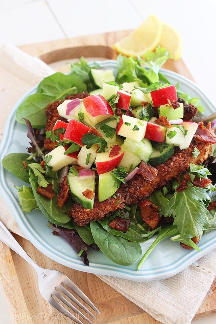 Crispy Chicken Salad with Apples and Bacon – Crispy chicken with a fresh, crunchy apple-cucumber salsa and bacon tops mixed greens. Makes for a mouthwatering weeknight meal! | thecomfortofcooking.com