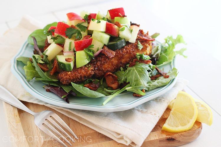 Crispy Chicken Salad with Apples and Bacon – Crispy chicken with a fresh, crunchy apple-cucumber salsa and bacon tops mixed greens. Makes for a mouthwatering weeknight meal! | thecomfortofcooking.com