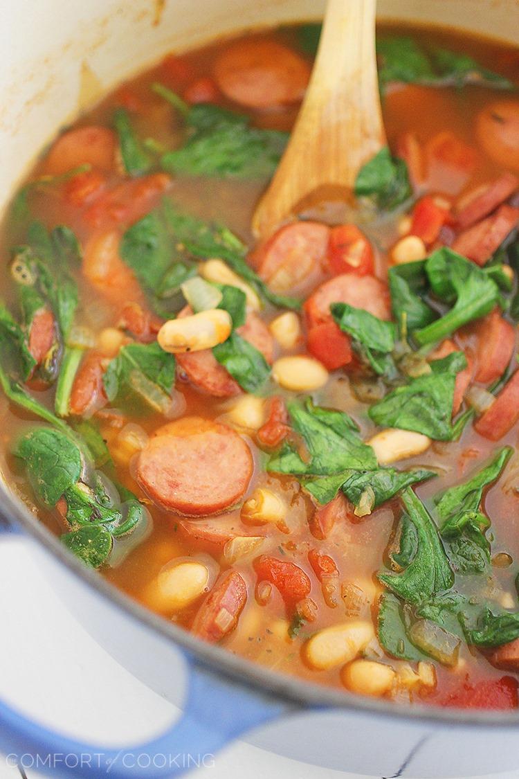 Smoked Sausage, Spinach and White Bean Soup – Hearty, healthy and full of flavor, this soup is our new favorite weeknight meal. You won't believe how simple it is, too! | thecomfortofcooking.com