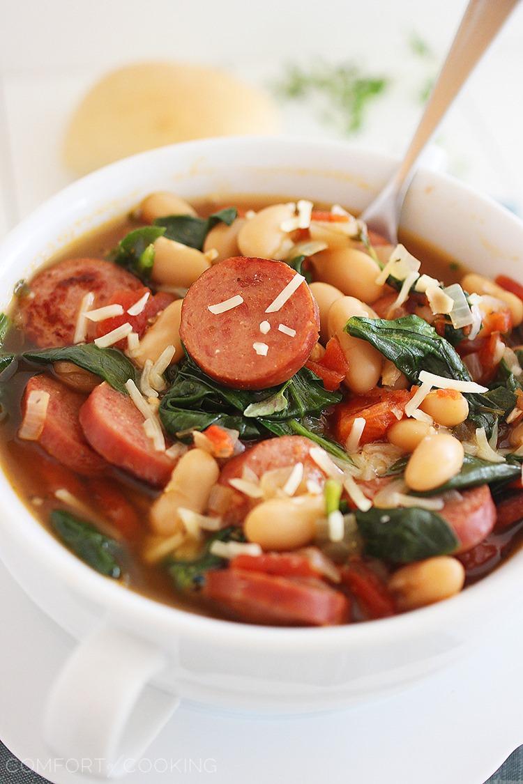 Smoked Sausage, Spinach and White Bean Soup – Hearty, healthy and full of flavor, this soup is our new favorite weeknight meal. You won't believe how simple it is, too! | thecomfortofcooking.com