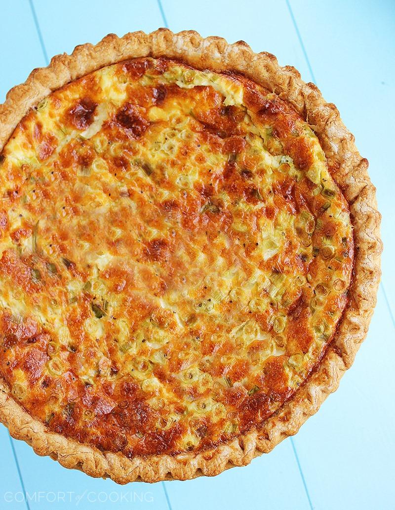 Cheesy Ham, Cheddar and Scallion Quiche – All you need for this cheesy, golden brown quiche is 5 ingredients, plus pie crust and spices. Perfect for lazy brunching! | thecomfortofcooking.com