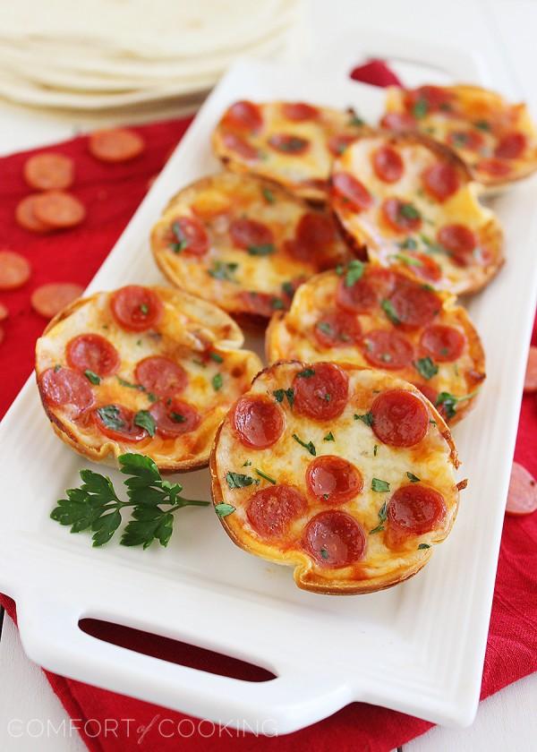 Easy Mini Tortilla Pizzas – These crisp and gooey pizzas just need 4 ingredients and 10 minutes. Bake 'til bubbly and golden in your muffin tin! | thecomfortofcooking.com