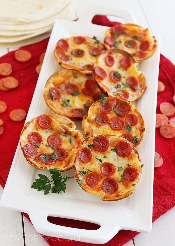 Easy Mini Tortilla Pizzas – These crisp and gooey pizzas just need 4 ingredients and 10 minutes. Bake 'til bubbly and golden in your muffin tin! | thecomfortofcooking.com