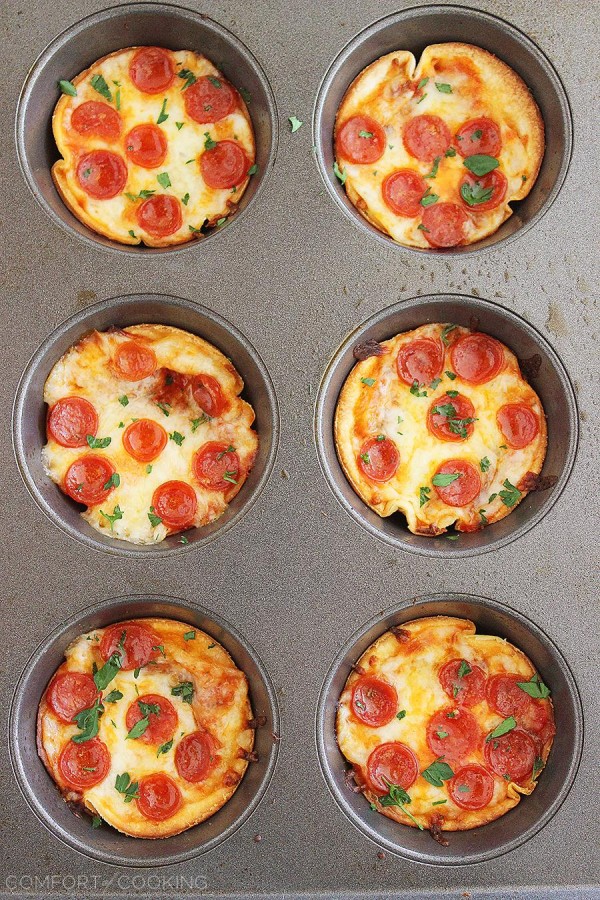 Easy Mini Tortilla Pizzas – These crisp and gooey pizzas just need 4 ingredients and 10 minutes. Bake 'til bubbly and golden in your muffin tin! | thecomfortofcooking.com