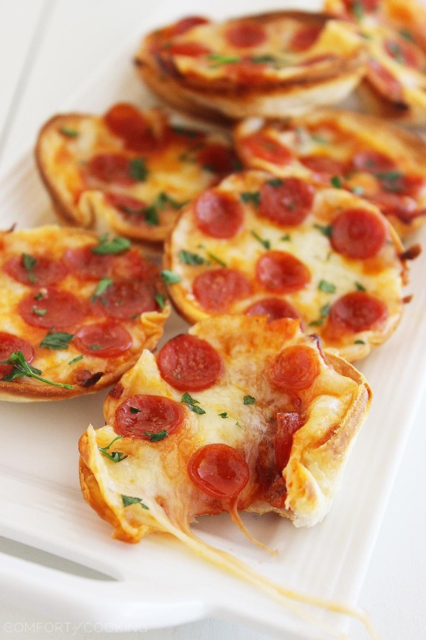 Easy Mini Tortilla Pizzas – These crisp and gooey pizzas just need 4 ingredients and 10 minutes. Bake 'til bubbly and golden in your muffin tin! | thecomfortofcooking.com