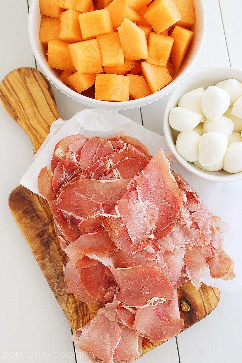 Melon, Proscuitto and Mozzarella Skewers – These sweet and salty skewers with prosciutto, melon and creamy mozzarella are easy bites for any party! | thecomfortofcooking.com