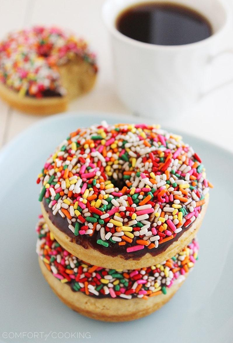 Fluffy Chocolate Frosted Donuts – These soft donuts are baked and not fried, but still taste extra indulgent for breakfast! Perfect with a cup of hot coffee. | thecomfortofcooking.com