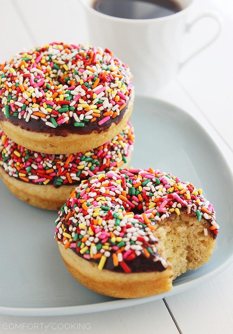 Fluffy Chocolate Frosted Donuts – These soft donuts are baked and not fried, but still taste extra indulgent for breakfast! Perfect with a cup of hot coffee. | thecomfortofcooking.com