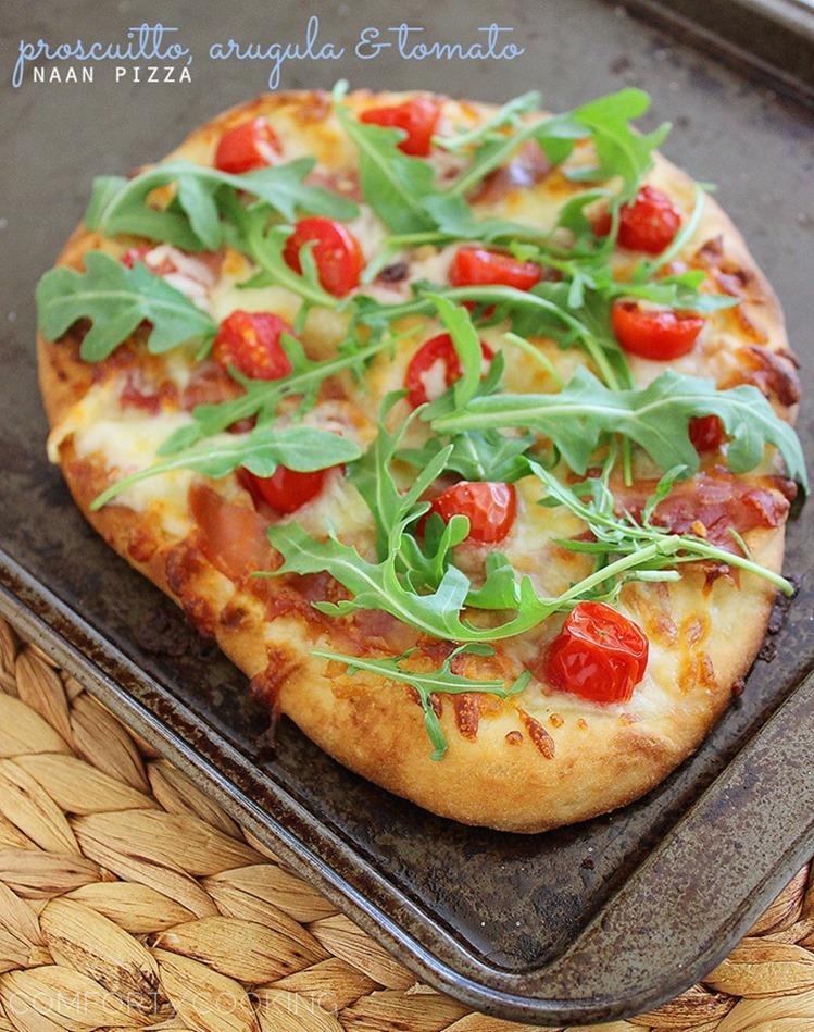 Proscuitto, Arugula and Tomato Naan Pizza – These crisp, colorful pizzas with tomatoes, prosciutto and fresh arugula take only 10 minutes for a healthy lunch or dinner! | thecomfortofcooking.com