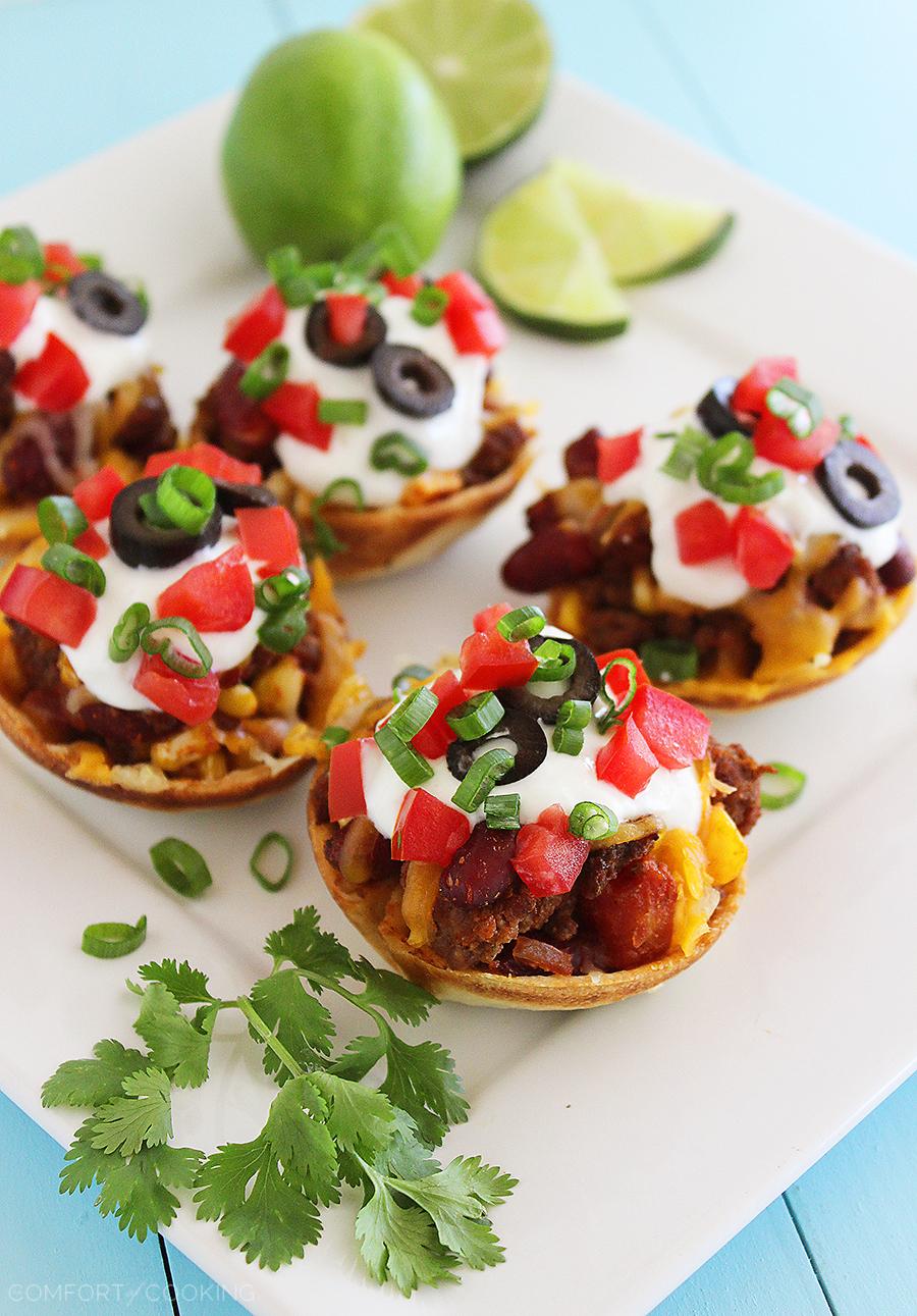 Mini Mexican Chili Tortilla Cups – Hearty, cheesy chili scooped into crisp tortilla shells makes these a huge hit for parties and weeknights! | thecomfortofcooking.com