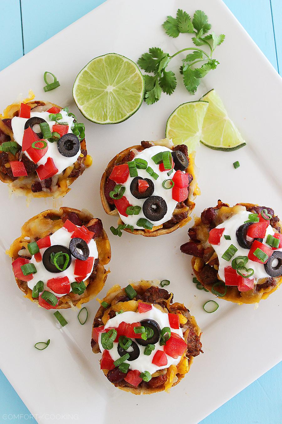 Mini Mexican Chili Tortilla Cups – Hearty, cheesy chili scooped into crisp tortilla shells makes these a huge hit for parties and weeknights! | thecomfortofcooking.com