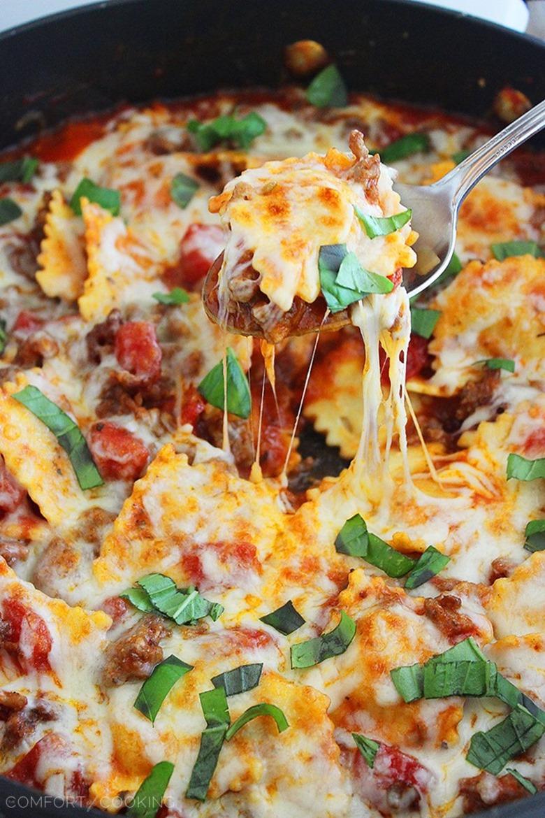 Cheesy Ravioli and Italian Sausage Skillet – This cheesy, saucy ravioli skillet with Italian sausage makes for one scrumptious weeknight meal! | thecomfortofcooking.com