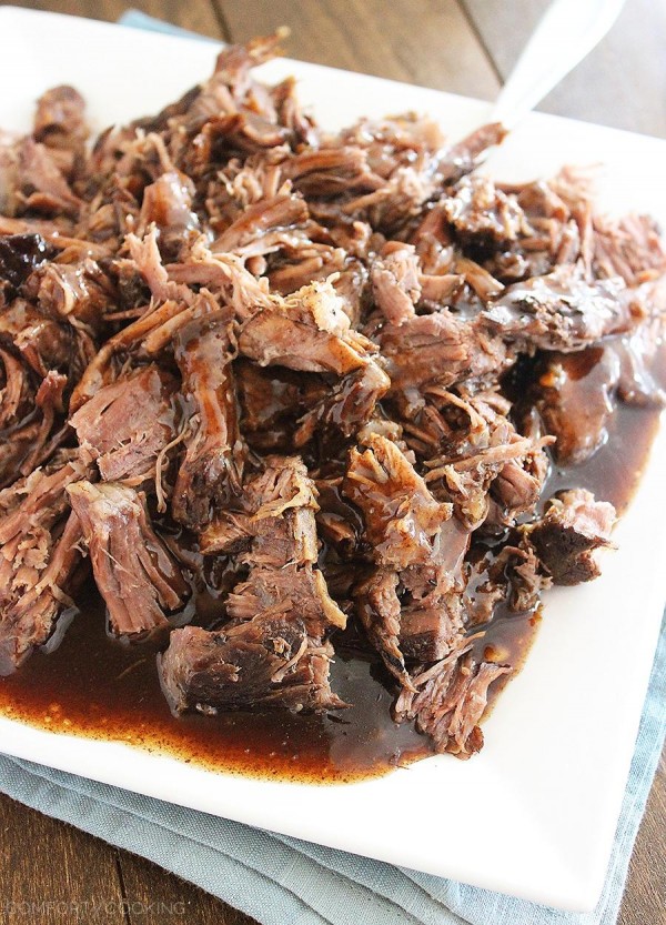 Slow Cooker Balsamic Glazed Roast Beef – This tangy, sweet and salty beef roast makes for one mouthwatering meal on a bun, or served on top of fluffy mashed potatoes! | thecomfortofcooking.com