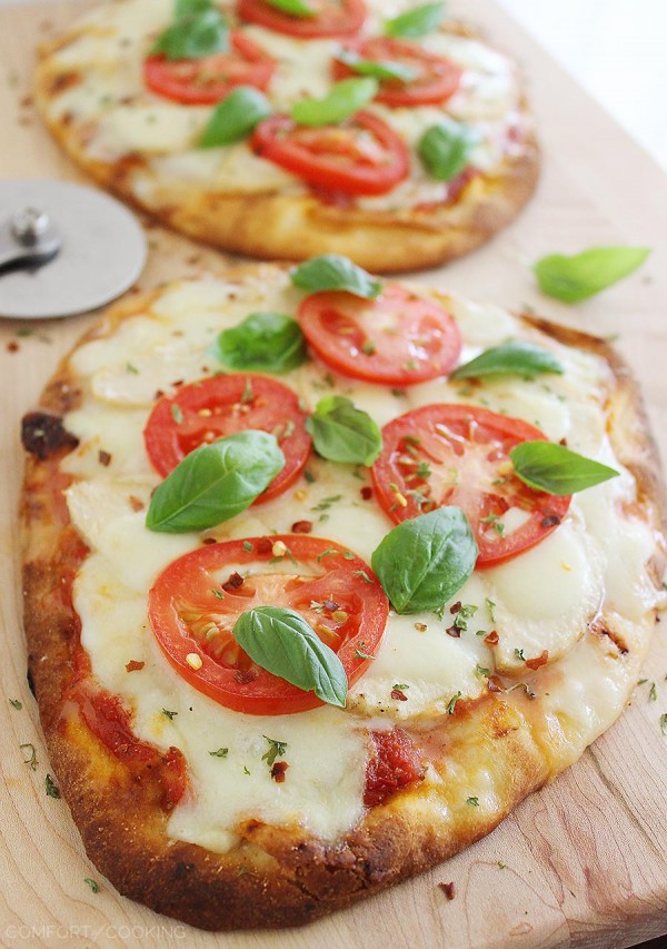 Cheesy Chicken Parmesan Flatbread Pizza – These cheesy, crisp chicken, mozzarella and tomato pizzas are so easy! Serve with a green salad for a healthy dinner. | thecomfortofcooking.com