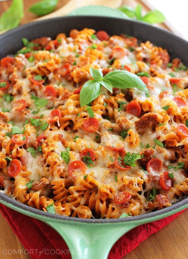 Cheesy Skillet Pizza Pasta – Try this saucy, scrumptious pizza-meets-pasta dish for a fun weeknight meal! It's easily made from scratch in one skillet! | thecomfortofcooking.com