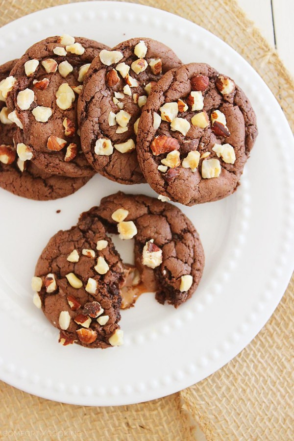 Easy Chocolate Caramel-Stuffed Cookies – These soft, chewy chocolate cookies with a gooey caramel center are made with a cake mix! | thecomfortofcooking.com