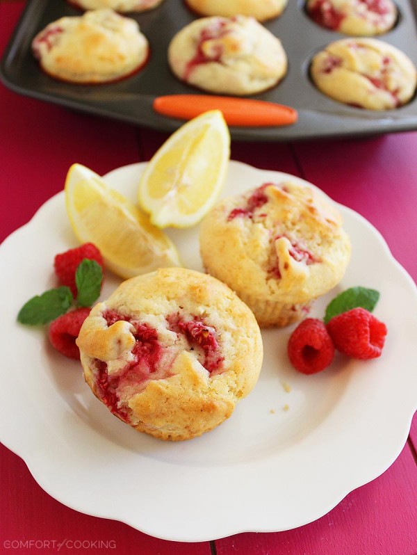Super Soft Lemon-Raspberry Muffins – Wake up to a batch of these super soft, summery lemon raspberry muffins. They freeze and reheat easily, too! | thecomfortofcooking.com