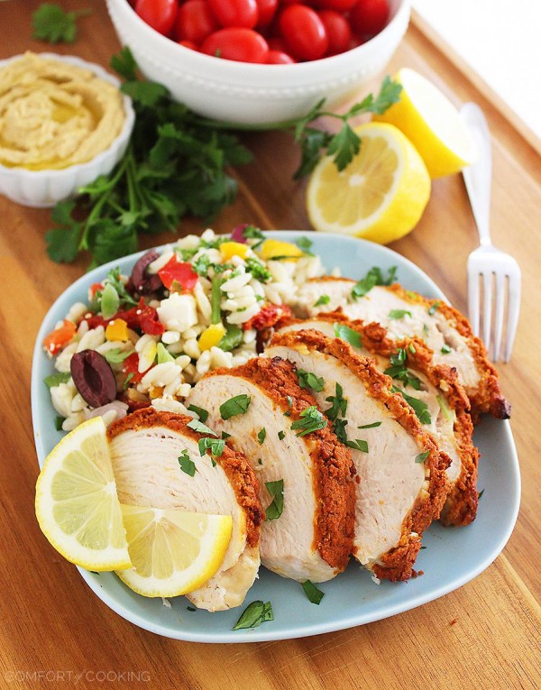 Baked Hummus-Crusted Lemon Chicken – Use leftover hummus to make a crispy, creamy topping for baked chicken! Add a squeeze of lemon and a salad for an easy, fresh meal. | thecomfortofcooking.com