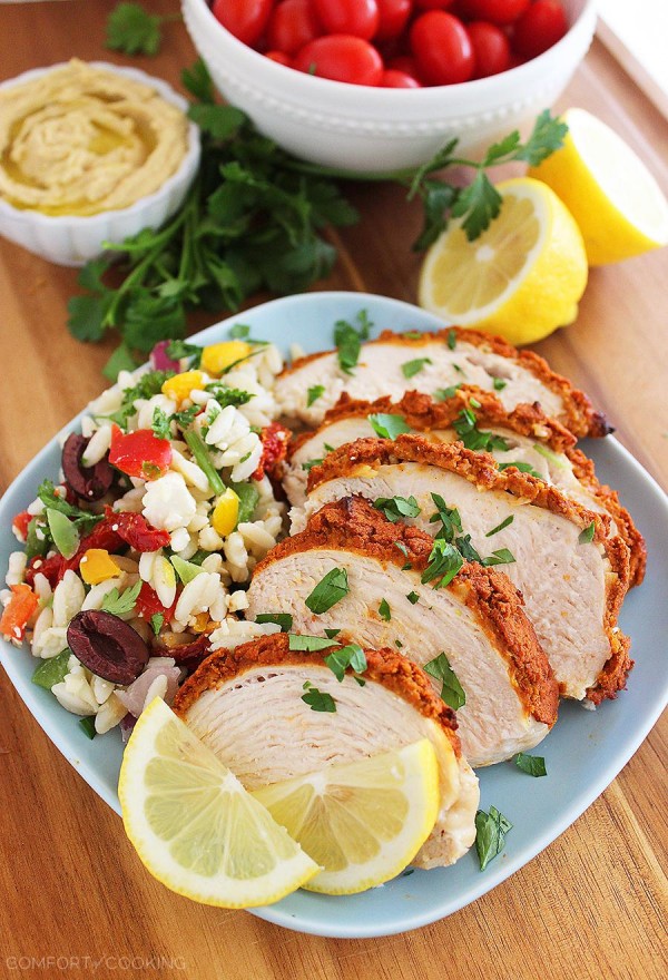 Baked Hummus-Crusted Lemon Chicken – Use leftover hummus to make a crispy, creamy topping for baked chicken! Add a squeeze of lemon and a salad for an easy, fresh meal. | thecomfortofcooking.com