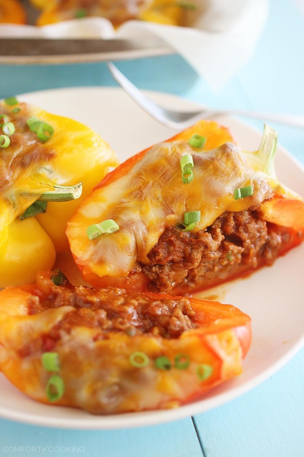 Sloppy Joe Stuffed Peppers –Two classic comfort foods combine to make one mouthwatering meal. You have GOT to try these cheesy, delicious stuffed peppers! | thecomfortofcooking.com