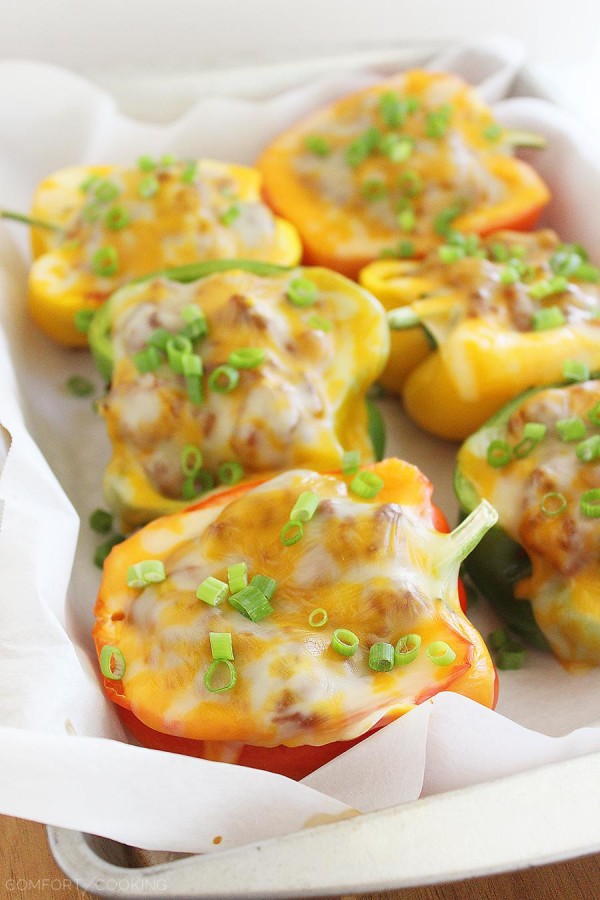 Sloppy Joe Stuffed Peppers –Two classic comfort foods combine to make one mouthwatering meal. You have GOT to try these cheesy, delicious stuffed peppers! | thecomfortofcooking.com