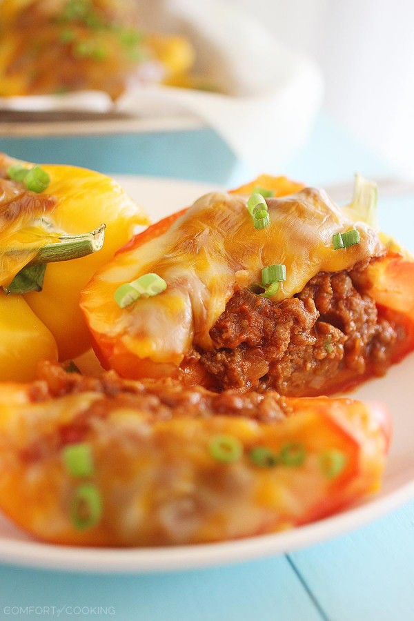 Sloppy Joe Stuffed Peppers –Two classic comfort foods combine to make one mouthwatering meal. You have GOT to try these cheesy, delicious stuffed peppers! | thecomfortofcooking.com