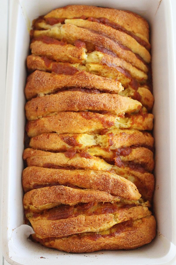 Pumpkin Spice Pull Apart Bread with Vanilla Glaze – Every layer is full of soft, gooey goodness and tastes just like a cinnamon roll (made MUCH simpler). | thecomfortofcooking.com