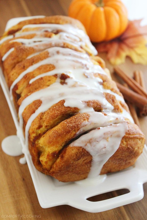 Pumpkin Spice Pull Apart Bread with Vanilla Glaze – Every layer is full of soft, gooey goodness and tastes just like a cinnamon roll (made MUCH simpler). | thecomfortofcooking.com