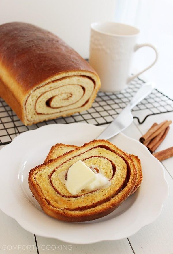 Soft Cinnamon Swirl Bread – Slice into a loaf of warm cinnamon-spiced swirl bread with your morning coffee! This easy recipe bakes two loaves. | thecomfortofcooking.com