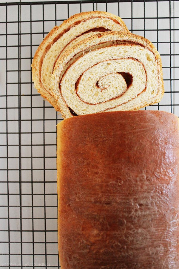 Soft Cinnamon Swirl Bread – Slice into a loaf of warm cinnamon-spiced swirl bread with your morning coffee! This easy recipe bakes two loaves. | thecomfortofcooking.com