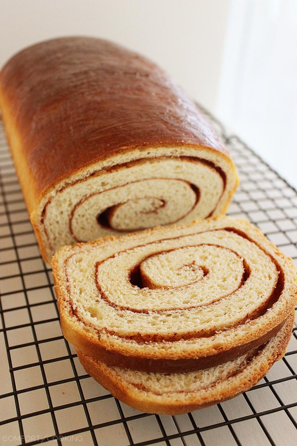 Soft Cinnamon Swirl Bread – Slice into a loaf of warm cinnamon-spiced swirl bread with your morning coffee! This easy recipe bakes two loaves. | thecomfortofcooking.com