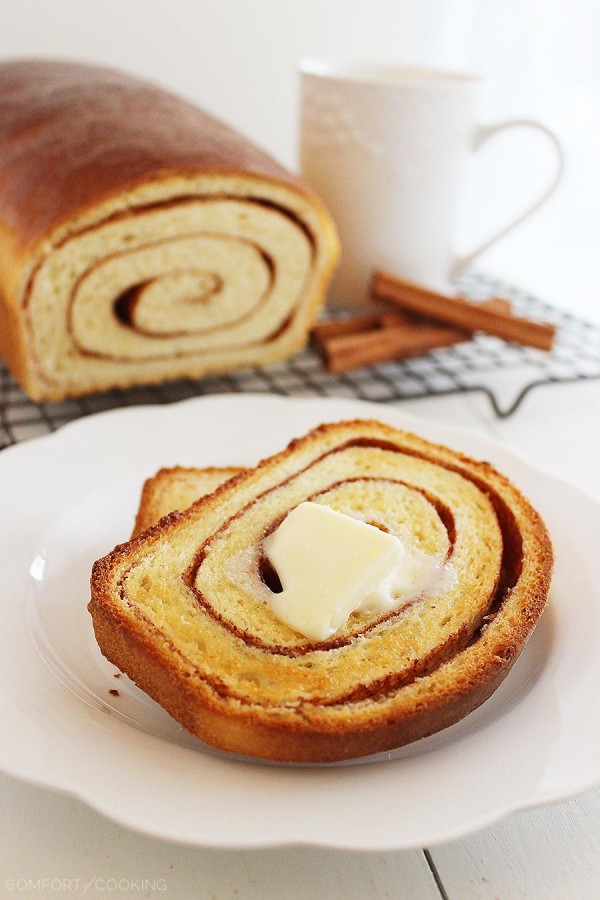 Soft Cinnamon Swirl Bread – Slice into a loaf of warm cinnamon-spiced swirl bread with your morning coffee! This easy recipe bakes two loaves. | thecomfortofcooking.com