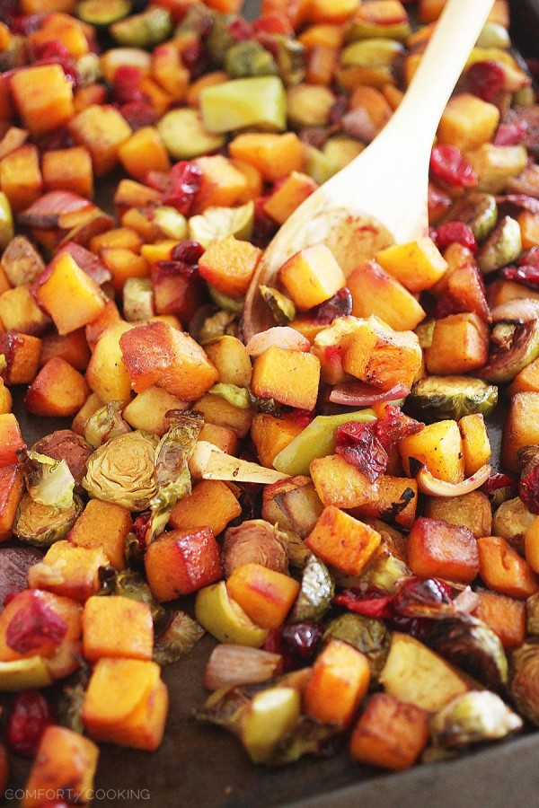 Roasted Butternut Squash and Brussels Sprouts with Cranberries, Apples and Onions – This colorful, healthy medley is so delicious, and also makes a delicious meal (or add cooked sausage). | thecomfortofcooking.com