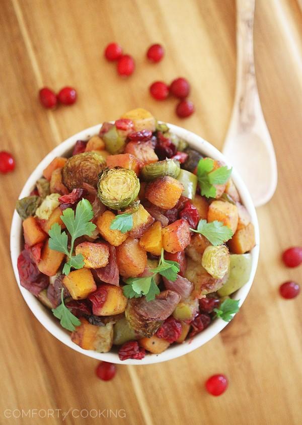 Roasted Butternut Squash and Brussels Sprouts with Cranberries, Apples and Onions – This colorful, healthy medley is so delicious, and also makes a delicious meal (or add cooked sausage). | thecomfortofcooking.com