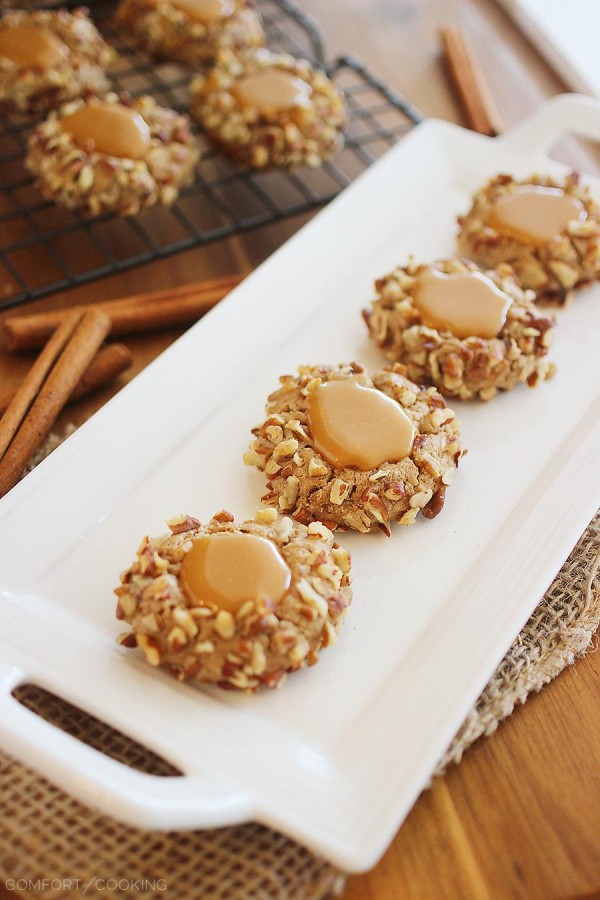 Caramel Spice Thumbprint Cookies – Bake a batch of caramel-filled thumbprint cookies to give to someone special! They're adorable, delicious and easier to make than you may think. Chopped pecans make the perfect pretty coating!| thecomfortofcooking.com