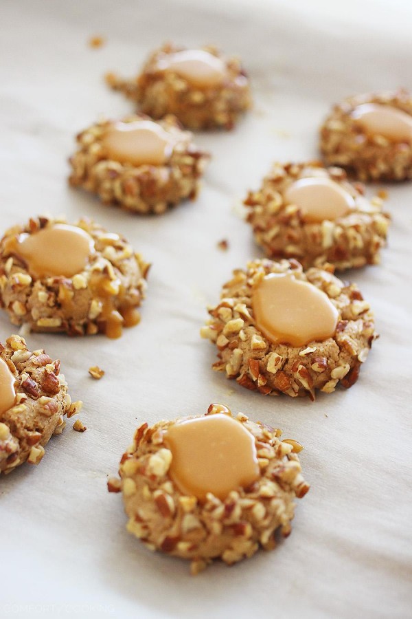 Caramel Spice Thumbprint Cookies – Bake a batch of caramel-filled thumbprint cookies to give to someone special! They're adorable, delicious and easier to make than you may think. Chopped pecans make the perfect pretty coating!| thecomfortofcooking.com